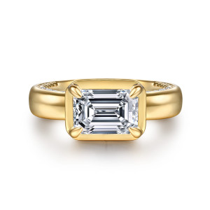 Gabriel & Co. ER16708E8Y44JJ 14 karat yellow gold Contemporary engagement ring, front view of a sideways emerald cut center in a rounded frame with a claw at each corner
