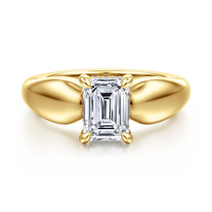 Gabriel & Co. ER16709E6Y44JJ 14 karat yellow gold Contemporary engagement ring, front view of an emerald cut center rising between two broad, smoothly swelling shoulders