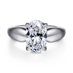 Gabriel & Co. ER16709O12W44JJ 14 karat white gold Contemporary engagement ring, front view of an oval center between broad polished shoulders with no stones showing on top