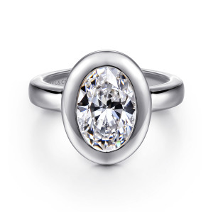 Gabriel & Co. ER16710O8W4JJJ 14 karat white gold Contemporary engagement ring, front view of an oval center inside a thick, smooth bezel with an even rim all around