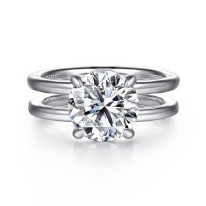 Gabriel & Co. ER16711R12W44JJ 14 karat white gold Contemporary engagement ring, front view of a round center held by four tapered prongs across an open split band