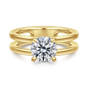 Gabriel & Co. ER16711R6Y44JJ 14 karat yellow gold Contemporary engagement ring, front view of a split shank with an open channel below a round center on rounded prongs