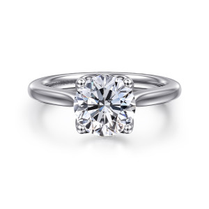 Gabriel & Co. ER16712R8W4JJJ 14 karat white gold Lotus engagement ring, front view of a round center in ball tipped prongs on a smooth band that widens upward