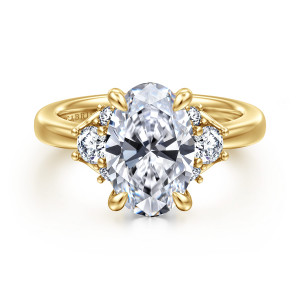 Gabriel & Co. ER16714O12Y44JJ 14 karat yellow gold Lotus engagement ring, front view of an oval center with leaf tipped prongs, a larger round stone between two smaller ones