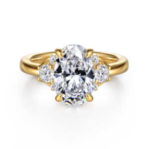 Gabriel & Co. ER16714O8Y44JJ 14 karat yellow gold Lotus engagement ring, front view of an oval center with a larger round side stone and small stones on each side