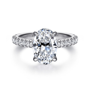 Gabriel & Co. ER16719O8W44JJ 14 karat white gold Lotus engagement ring, front view of an oval center held by four claw prongs with diamonds running along both shoulders