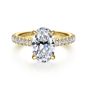 Gabriel & Co. ER16719O8Y44JJ 14 karat yellow gold Lotus engagement ring, front view of an oval center with pointed claw prongs and diamond shoulders on both sides