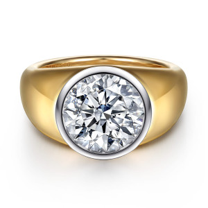 Gabriel & Co. ER16723R16M4JJJ 14 karat white and yellow gold Contemporary engagement ring, front view of a round center in a full bezel on a broad tapering shank