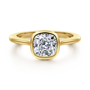 Gabriel & Co. ER16728C6Y4JJJ 14 karat yellow gold Contemporary engagement ring, front view of a rounded cushion bezel enclosing the center, band sweeping out on both sides