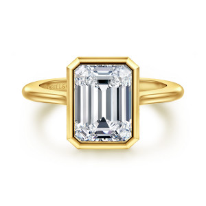 Gabriel & Co. ER16728E12Y4JJJ 14 karat yellow gold Contemporary engagement ring, front view of an emerald cut center inside a bezel with clipped corners