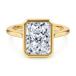 Gabriel & Co. ER16728N16Y4JJJ 14 karat yellow gold Contemporary engagement ring, front view of a polished bezel with clipped corners around a rectangular center