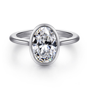 Gabriel & Co. ER16728O8W4JJJ 14 karat white gold Contemporary engagement ring, front view of the oval center wrapped in a smooth rimmed bezel on a plain band