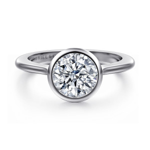 Gabriel & Co. ER16728R6W4JJJ 14 karat white gold Contemporary engagement ring, front view of the round center fully wrapped by a smooth bezel rim on a plain band