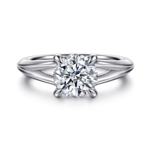 Gabriel & Co. ER16730R6W4JJJ 14 karat white gold Contemporary engagement ring, front view of a round center in four claw prongs with the split arms rising beside it