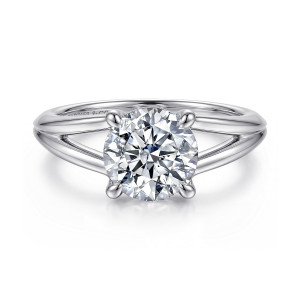 Gabriel & Co. ER16730R8W4JJJ 14 karat white gold Contemporary engagement ring, front view of the round center in rounded claws with the band splitting open on each side