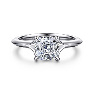 Gabriel & Co. ER16734C6W44JJ 14 karat white gold Contemporary engagement ring, front view of a cushion cut center with flared shoulders sweeping to a knife edge