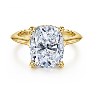 Gabriel & Co. ER16734G20Y44JJ 14 karat yellow gold Contemporary engagement ring, front view of an elongated cushion center in four prongs with pointed shoulders on the band