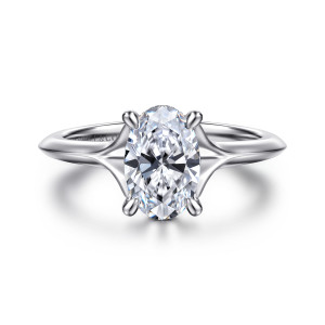 Gabriel & Co. ER16734O6W44JJ 14 karat white gold Contemporary engagement ring, front view of an oval center with the band parting into slim arms at each shoulder