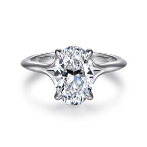 Gabriel & Co. ER16734O8W44JJ 14 karat white gold Contemporary engagement ring, front view of an oval center with the band splitting into two arms at each shoulder