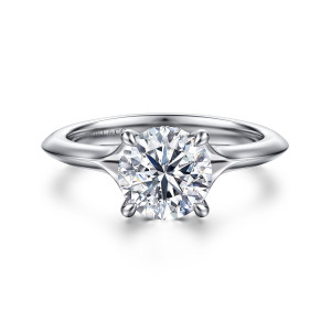 Gabriel & Co. ER16734R6W44JJ 14 karat white gold Contemporary engagement ring, front view of a round center on four prongs above a band with crisp knife edge shoulders