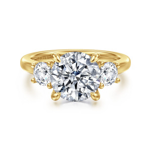Gabriel & Co. ER16737R10Y44JJ 14 karat yellow gold Classic engagement ring, front view of a round center in four teardrop tipped prongs between two round side diamonds