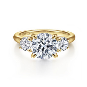 Gabriel & Co. ER16737R8Y44JJ 14 karat yellow gold Classic engagement ring, front view of a round center in four prongs between two round side diamonds, each in small prongs