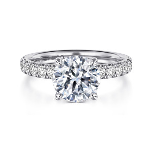 Gabriel & Co. ER16738R8W44JJ 14 karat white gold Contemporary engagement ring, front view of a round center with a line of round stones on each shoulder