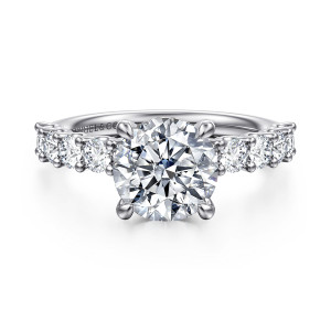 Gabriel & Co. ER16757R8W44JJ 14 karat white gold Contemporary engagement ring, front view of a round center with four rounded prongs and round diamonds on each shoulder
