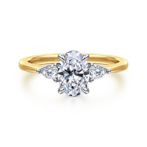 Gabriel & Co. ER16764O4M44JJ 14 karat white and yellow gold Classic engagement ring, front view of an oval center with an elongated side stone on each side above a slim band