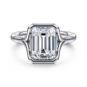 Gabriel & Co. ER16778E12W4JJJ 14 karat white gold Classic engagement ring, front view of an emerald cut center in a bezel frame with clipped corners