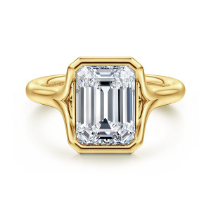 Gabriel & Co. ER16778E12Y4JJJ 14 karat yellow gold Classic engagement ring, front view of a clipped corner bezel around an emerald cut center