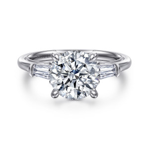 Gabriel & Co. ER16781R10W43JJ 14 karat white gold Classic engagement ring, front view of a round center between tapered baguettes with rounded end caps