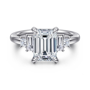 Gabriel & Co. ER16784E10W44JJ 14 karat white gold Contemporary engagement ring, front view of an emerald cut center between step cut and square side stones