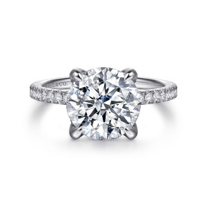 Gabriel & Co. ER16794R12W44JJ 14 karat white gold Classic engagement ring, front view of the round center on four claw prongs with a diamond row on each shoulder