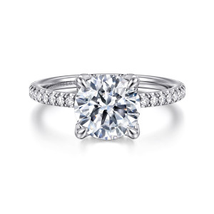 Gabriel & Co. ER16794R8W44JJ 14 karat white gold Classic engagement ring, front view of a round center on four prongs above slim shoulders lined with small diamonds