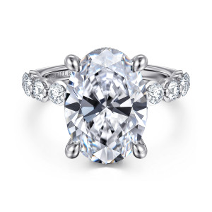 Gabriel & Co. ER16825O20W44JJ 14 karat white gold Contemporary engagement ring, front view of an oval center with four rounded prongs and round diamonds along the shoulders