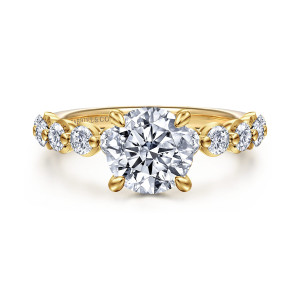 Gabriel & Co. ER16825R6Y44JJ 14 karat yellow gold Contemporary engagement ring, front view of a round center with leaf tipped prongs and cupped round stones on each shoulder