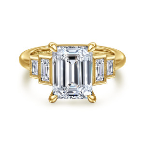 Gabriel & Co. ER16852E16Y43JJ 14 karat yellow gold Art Deco engagement ring, front view of an emerald cut center with four rounded prongs between stepped beaded baguette frames