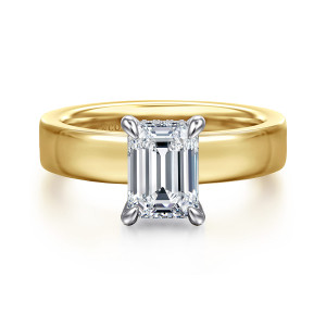 Gabriel & Co. ER16854E6M44JJ 14 karat white and yellow gold Classic engagement ring, front view of an emerald cut center in four claws on a broad flat band