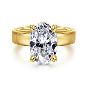 Gabriel & Co. ER16854O16Y44JJ 14 karat yellow gold Classic engagement ring, front view of an oval center on four teardrop tipped prongs above a wide flat band