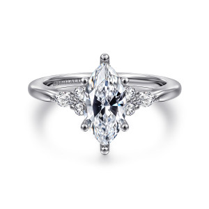 Gabriel & Co. ER16855M5W44JJ 14 karat white gold Starlight engagement ring, front view of a pointed center with round and elongated stones clustered on each shoulder
