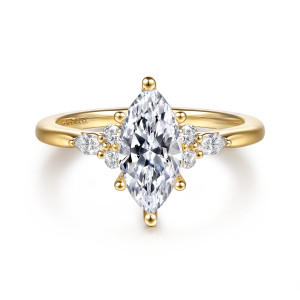 Gabriel & Co. ER16855M5Y44JJ 14 karat yellow gold Starlight engagement ring, front view of a marquise center with a small stone cluster on each shoulder