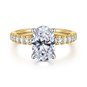Gabriel & Co. ER16856O8M44JJ 14 karat white and yellow gold Contemporary engagement ring, front view of an oval center in rounded prongs above a row of round diamonds