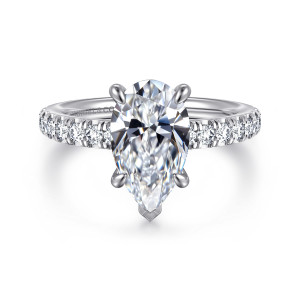 Gabriel & Co. ER16856P10W44JJ 14 karat white gold Contemporary engagement ring, front view of a pear shaped center with a V guard on its point above diamond lined shoulders