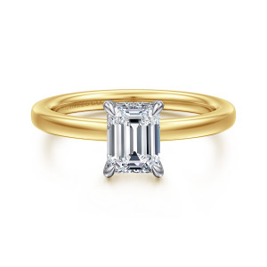 Gabriel & Co. ER16860E4M44JJ 14 karat white and yellow gold Classic engagement ring, front view of an emerald cut center with corner prongs and tiny stones beneath the head