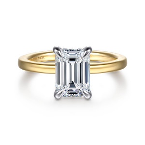 Gabriel & Co. ER16860E8M44JJ 14 karat white and yellow gold Classic engagement ring, front view of an emerald cut center held by four pointed prongs on a smooth plain band