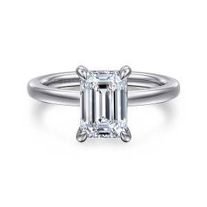 Gabriel & Co. ER16860E8W44JJ 14 karat white gold Classic engagement ring, front view of an emerald cut center between four tapered claws on a smooth polished band