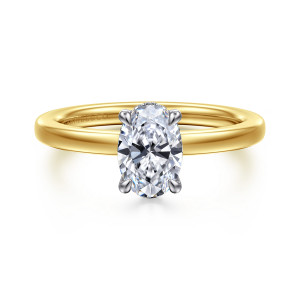Gabriel & Co. ER16860O4M44JJ 14 karat white and yellow gold Classic engagement ring, front view of an oval center in slim contrasting claw prongs on a smooth band