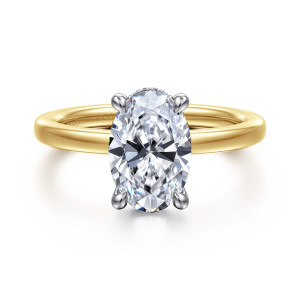 Gabriel & Co. ER16860O8M44JJ 14 karat white and yellow gold Classic engagement ring, front view of an oval center with rounded prongs and small stones at its far edge