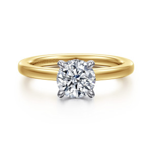 Gabriel & Co. ER16860R4M44JJ 14 karat white and yellow gold Classic engagement ring, front view of a round center in four tapered prongs with a maker's mark inside the band